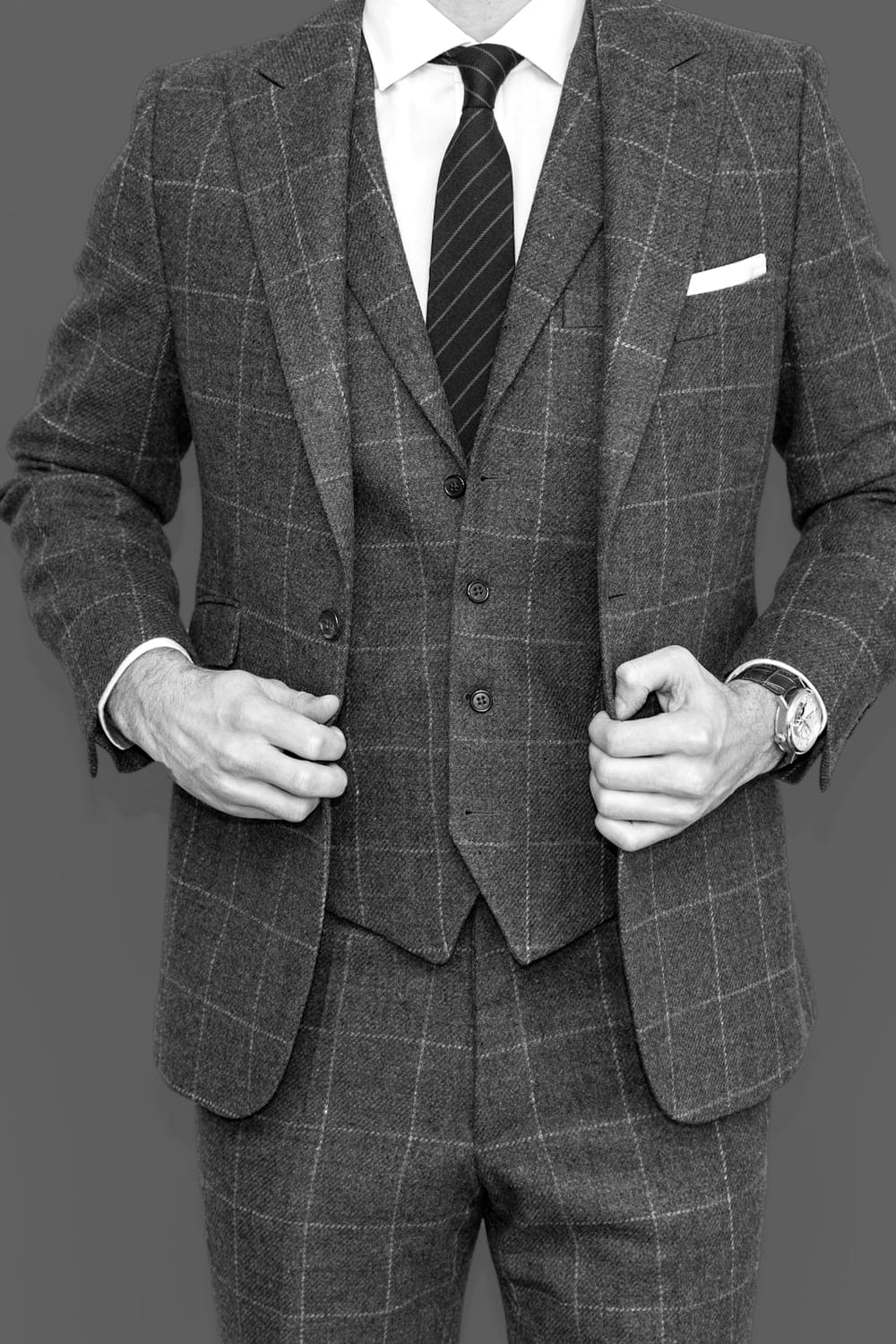 Eveningwear — a three-piece suit in muted check
