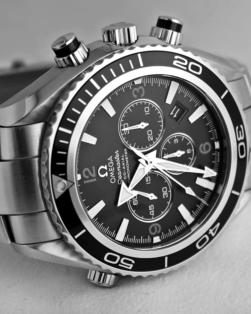 A monochrome close study of a luxury wristwatch