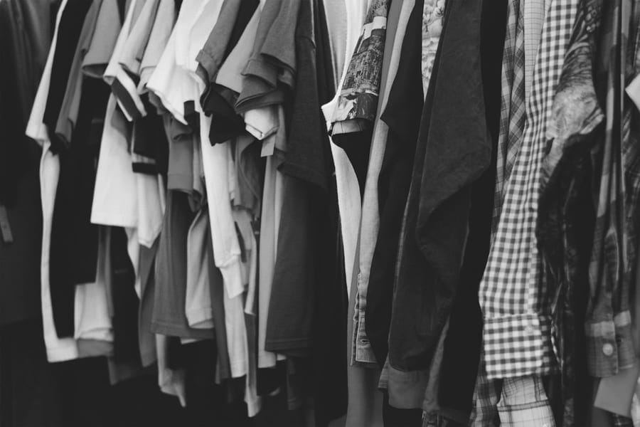 Look 06 — shirts hung on a rail in morning light