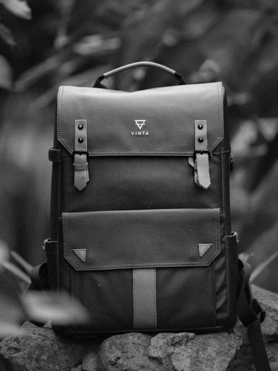 A structured leather backpack, studio still life