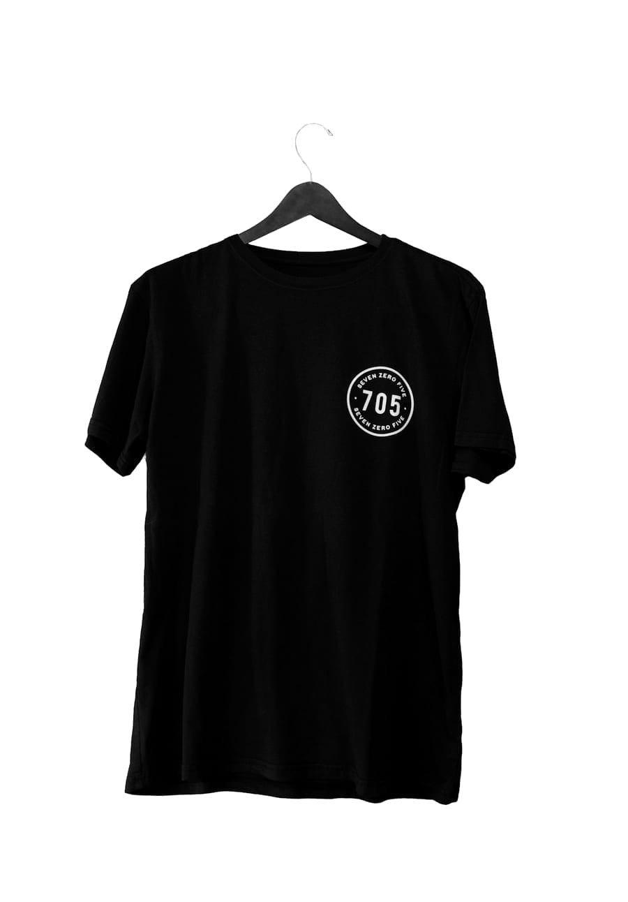 A cotton tee on a wooden hanger