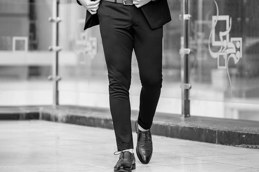 A tailored suit in movement, walking